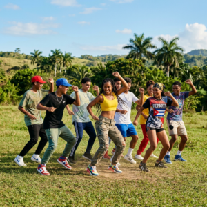 A group of young people is dancing outdoors today's cuban urban style Reggaetón|Reparto.